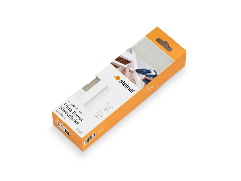 Verpakking oranje lijmsticks met een hetelijmpistool.