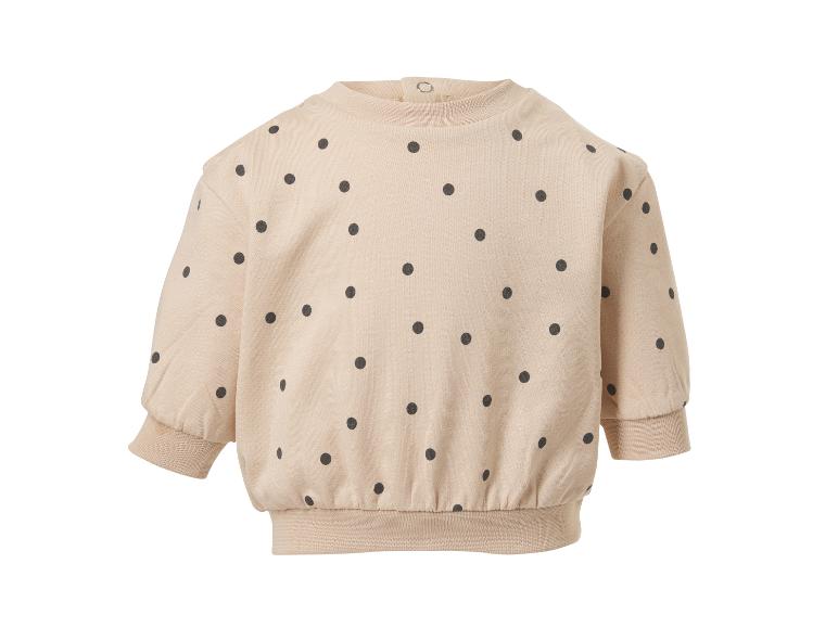 Beige kinderhoodie met zwarte stippen en lange mouwen