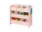 Roze kinderopbergrek met stoffen dozen en speelgoed.
