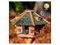 Houten vogelhuisje met twee koolmezen en wazige herfstachtergrond, 'ganzjährig füttern' logo.