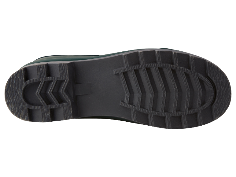 De zool van een donkergroene rubberen laars.