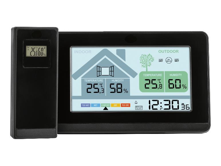 Digitale thermometer en hygrometer die binnen- en buitentemperatuur en luchtvochtigheid weergeeft.