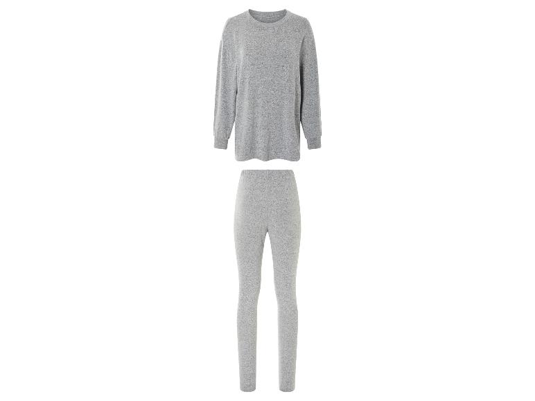 Grijze sweater en leggings voor vrouwen.