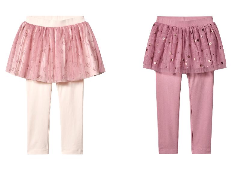 Twee kinderrok-leggings, één lichtroze met regenboogprint, één donkerroze met bloemensequins.