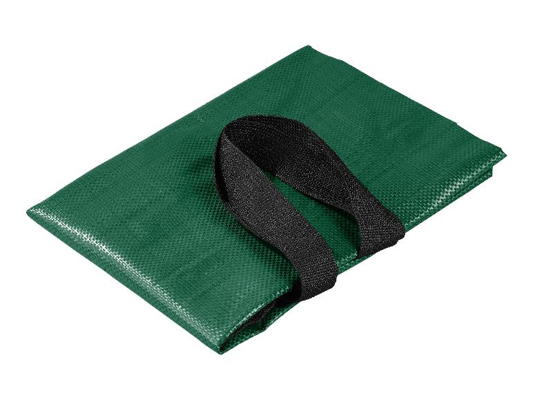 Groene opvouwbare boodschappentas met zwarte handvatten.