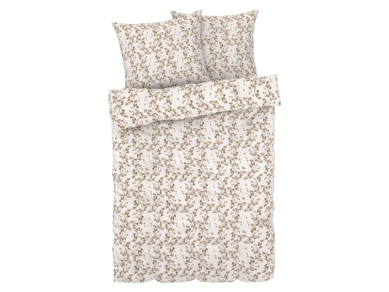 Een wit dekbedovertrek met bruin bladmotief.