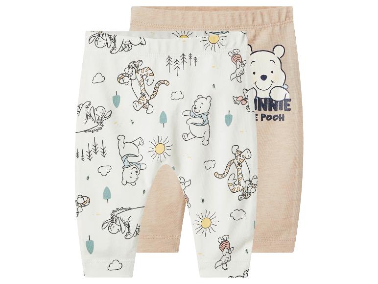 2-pack beige en witte babybroekjes met Winnie de Poeh-print.