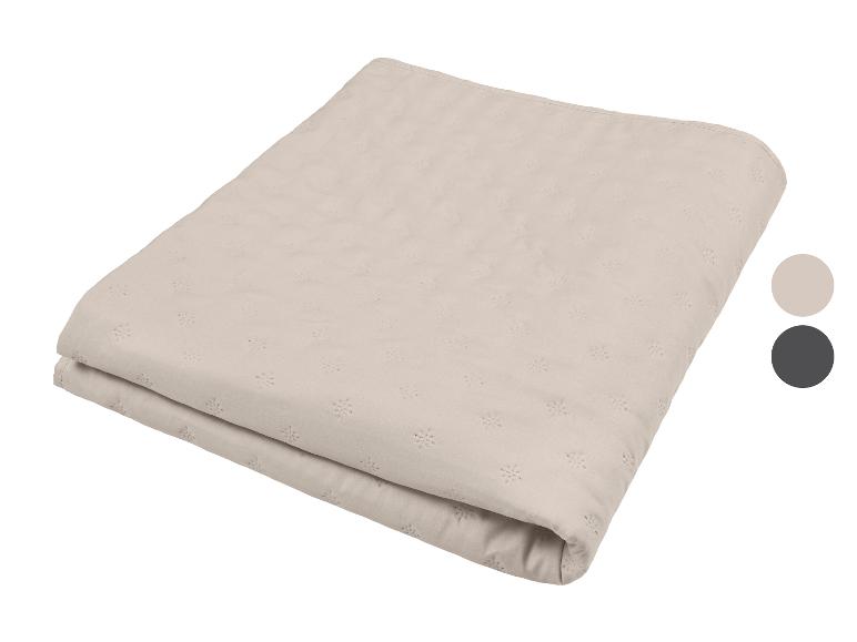 Beige deken met sneeuwvlokkenpatroon, met twee kleuropties aan de zijkant