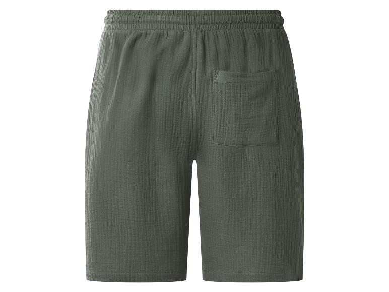 Donkergroene katoenen shorts met elastische tailleband en achterzak.