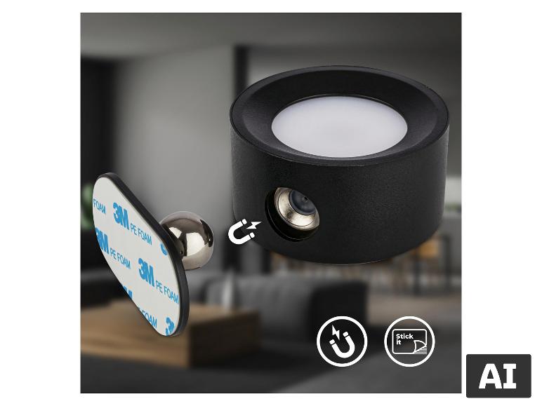 Zwarte magnetische LED-lamp met witte diffuser, getoond met zijn zelfklevende magnetische basis.