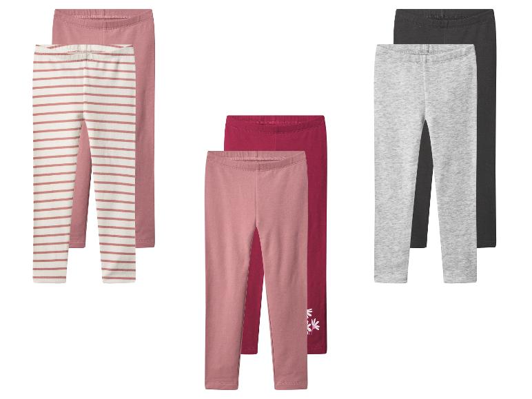 Drie sets kinderleggings: roze gestreept, effen roze/bordeaux en grijs/zwart.
