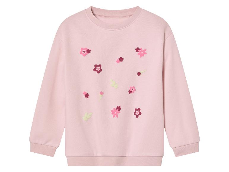 Roze meisjes trui met geborduurde bloemen.