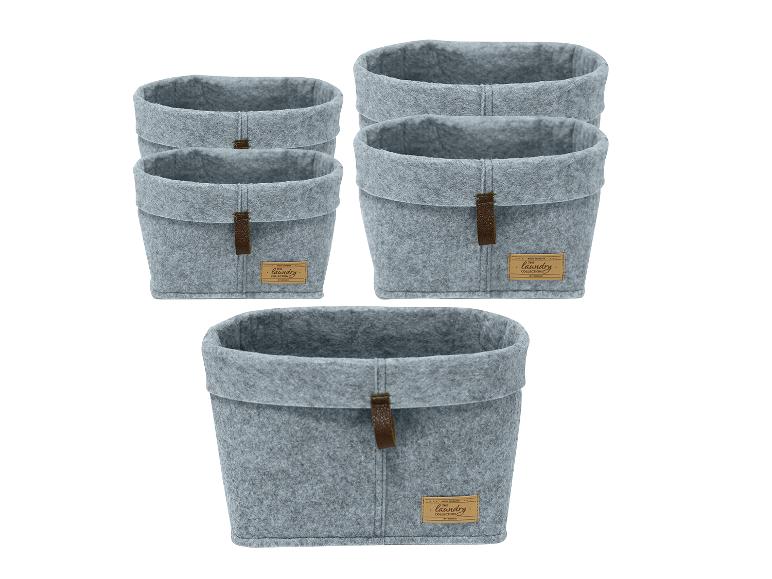 Vijf grijze Wenko wollen wasmanden.