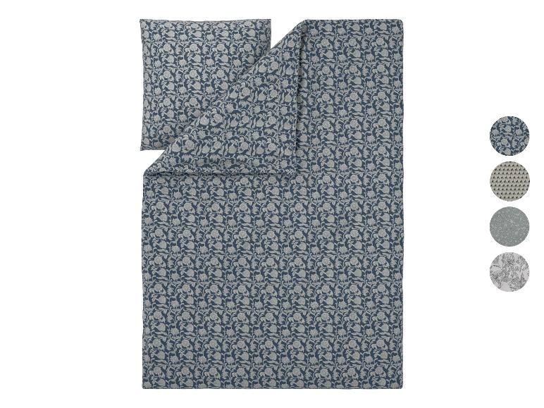 Dekbedovertrek en kussensloop set met blauw en grijs bloemenpatroon.