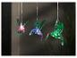 Hangende kolibri lampjes, kleurrijke buitendecoratie.