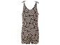 Een beige jumpsuit met een zwart geometrisch patroon.