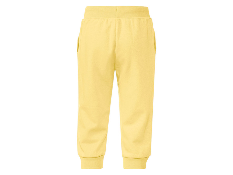 Gele joggingbroek met elastiek aan de taille.