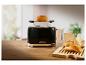 Zwarte 1995 toaster met brood erop.