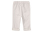 Beige babybroek met elastiek aan de taille.