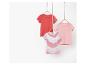 Drie kinder t-shirts: roze, koraalrood en roze-wit gestreept.