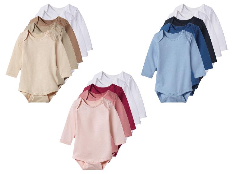 Sets van rompertjes met lange mouwen voor baby's in neutrale, blauwe en roze kleuren.