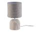 Beige tafellamp met een stoffen kap en keramische voet.