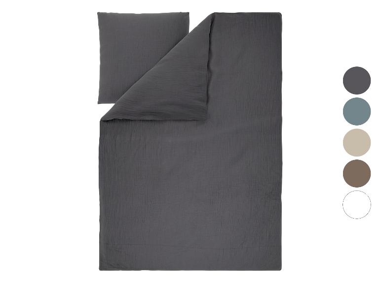 Donkergrijs mousseline beddengoedset met kussen en dekbedovertrek.