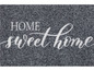 Een donkergrijze deurmat met de tekst 'Home sweet home'