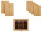 Twee bamboe snijplanken, vier kleinere bamboe snijplanken en een houten theebox met glazen deksel.