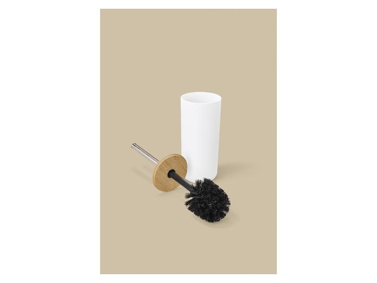 Zwarte toiletborstel met bamboe handvat en witte houder.