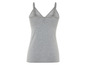 Een grijs, basic tanktop met spaghettibandjes.