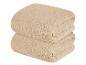 Twee beige, zachte, handdoeken met textuur.