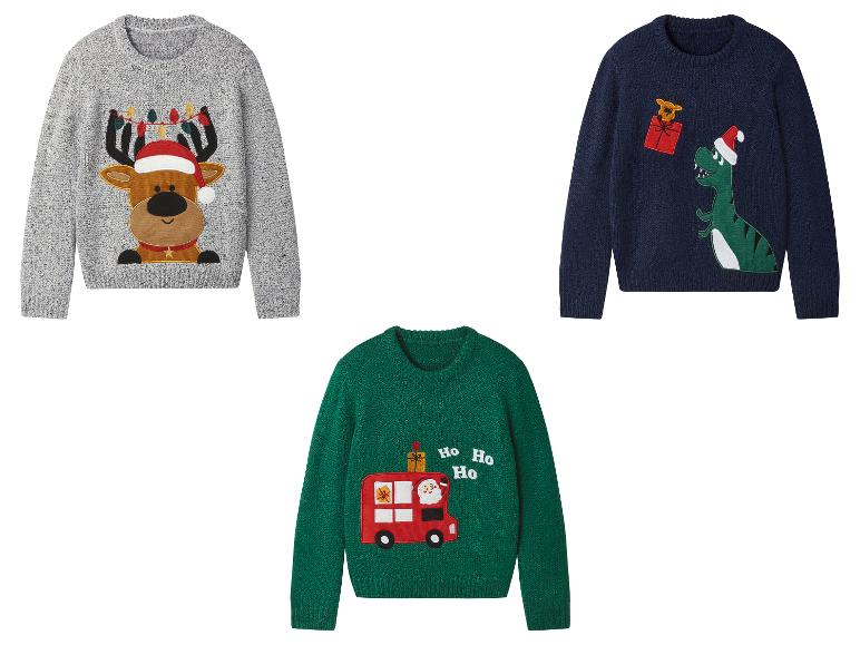 Drie kinderkersttruien: een rendier, een dinosaurus en een bus met de Kerstman.