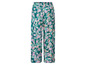 Lange, groene broek met bloemenprint.