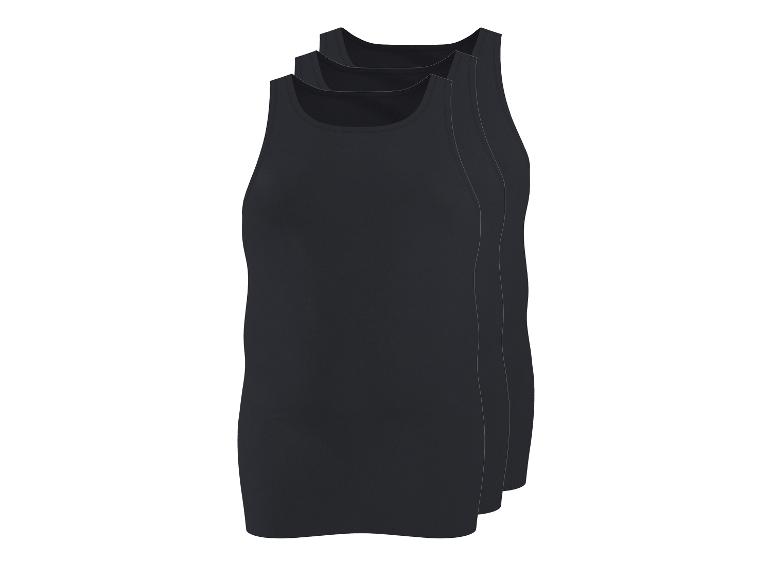 Drie zwarte tanktops in een verpakking.