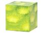 Groene kubus met gele bloempatronen, lijkend op een spons.