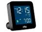 Zwarte digitale wekker met blauw display, toont 12:15 AM en wektijd 7:00 AM.