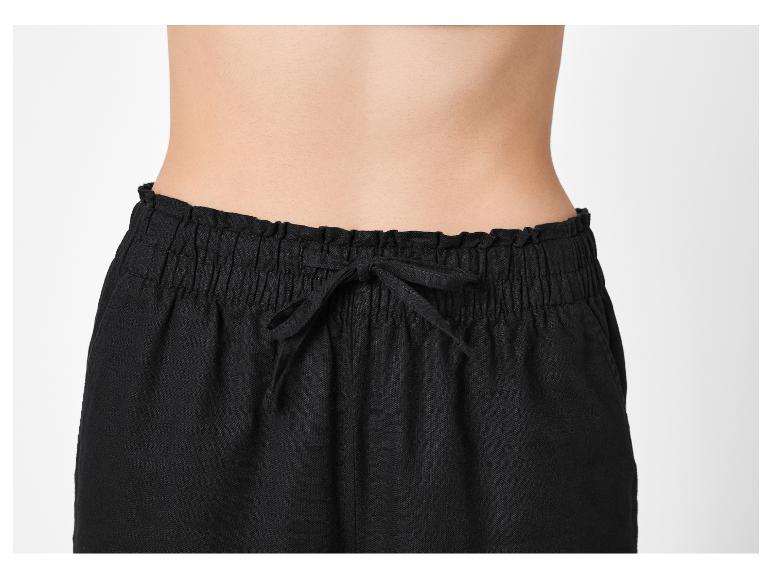 Zwarte damesbroek met elastische tailleband en trekkoord.