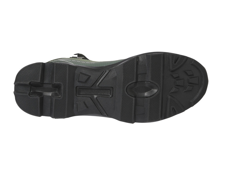 De zool van een groene sneaker met een grof profiel.