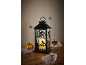 Halloween lantaarn met raven silhouetten, spinnen, pompoenen en spinnenwebben.