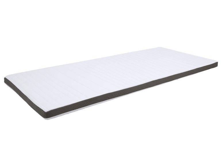 Witte topmatras met grijze rand, schuin afgebeeld.
