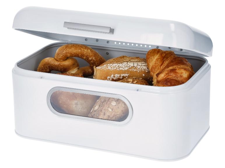 Witte broodtrommel met brood, broodjes en een croissant.