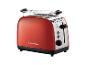 Een rode broodrooster van Russell Hobbs met een warmhoudrekje.
