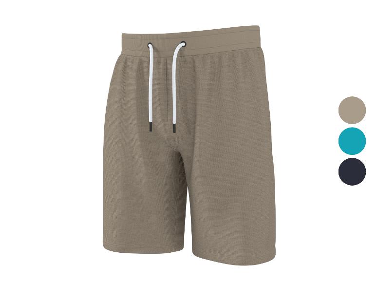 Beige sweatshorts met wit trekkoord, met blauwe en zwarte kleuropties.
