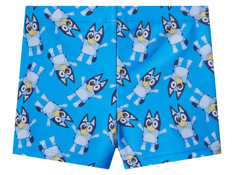 Blauwe kinderzwemshort met cartoonhondenpatroon.