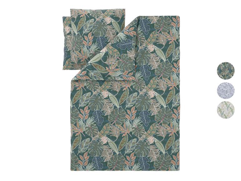Dekbedovertrekset met tropisch bladpatroon in donkergroen, bruin en beige.