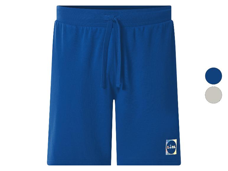 Blauwe joggingbroek met trekkoord in de taille en een klein logo op de pijp.
