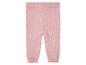 Roze gebreide broek voor baby's.