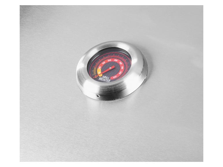 Grill Meister barbecuethermometer op een geborsteld metalen oppervlak