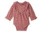 Roze babyromper met lange mouwen, hartjesprint en ruches
